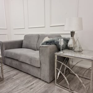 Hudson sofa in a room setting beside a table lamp and side table