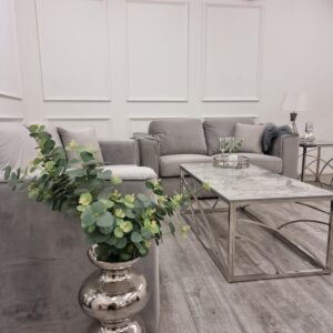 Hudson sofa set seen across a styled room with plants and coffee table