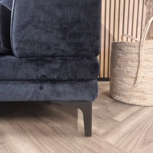 Detail of the Lenox sofa base and dark metal leg