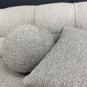 Close detail of the looped grey boucle fabric on the Aluxo Bubble sofa