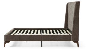 Side view of the Denver upholstered bed frame in mocha herringbone chenille showing the sprung slatted base and dark tapered wooden legs
