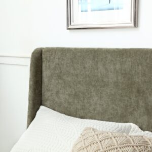 Close detail of the Denver bed curved wing headboard in olive herringbone chenille with cushions