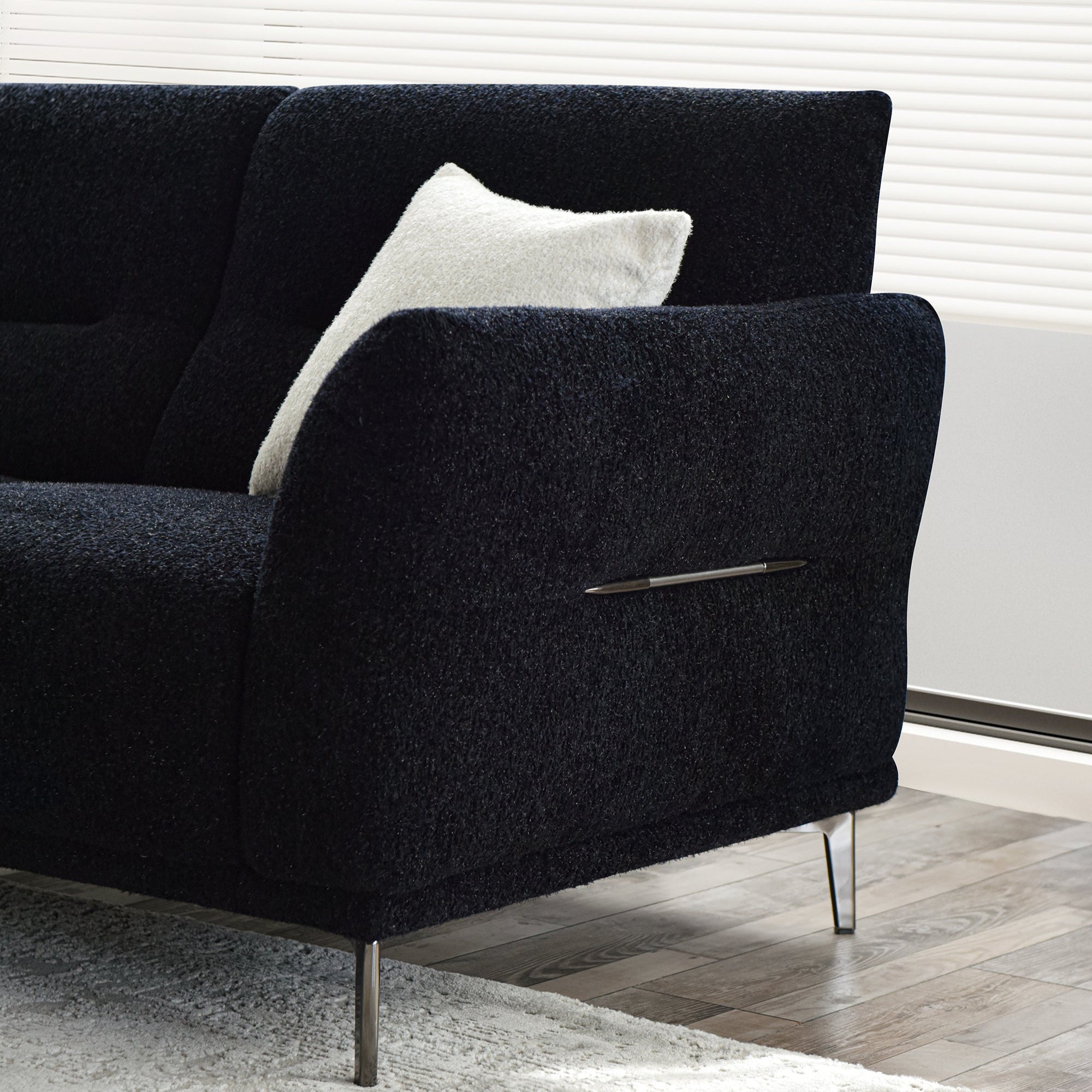 Albany black boucle sofa room setting showing the slim brushed metal legs