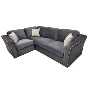 Lincoln four piece corner sofa shown on a plain background with chrome stud detailing