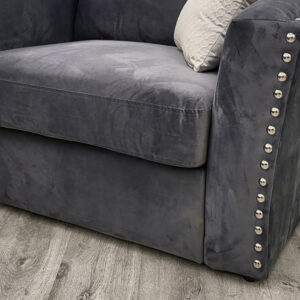Detail of the Lincoln corner sofa arm and stud trim