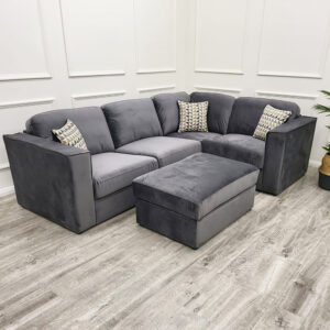 Hudson four piece corner sofa in steel shown with matching footstool in a room