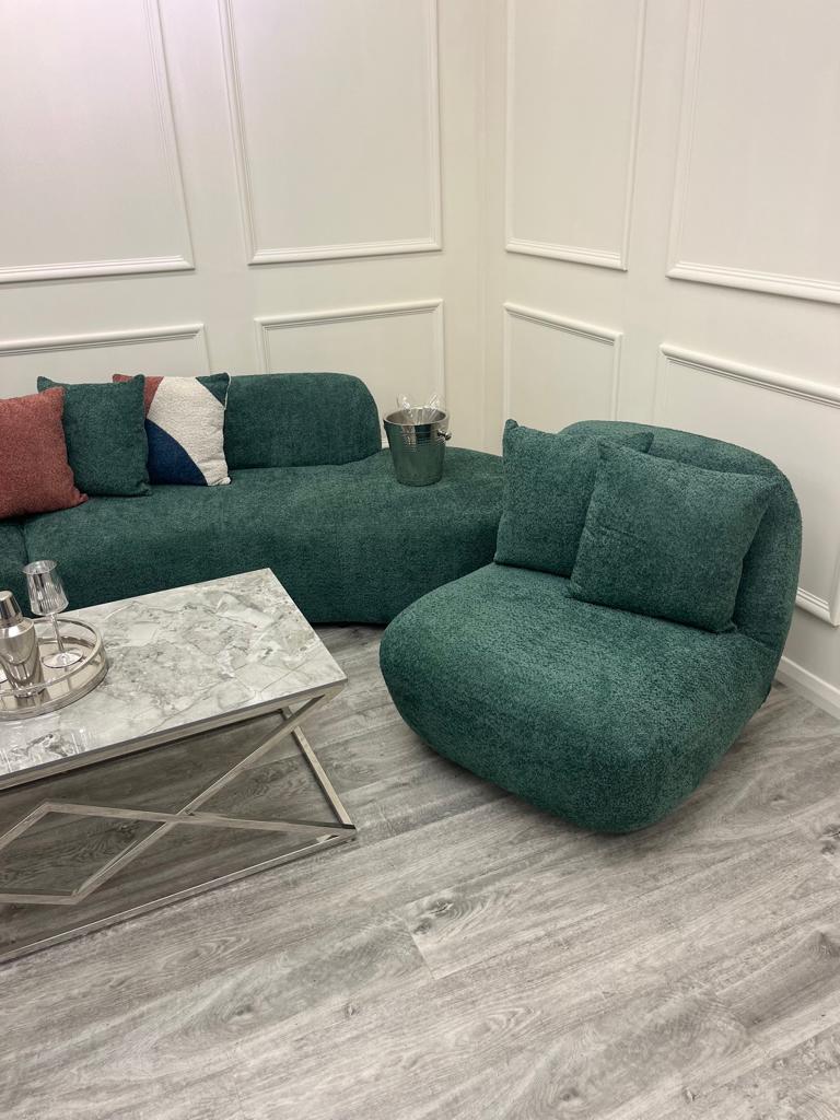 Two Miami swivel accent chairs in emerald green boucle with a matching footstool in a panelled room