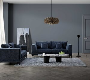 Lenox three and two seater sofas in aegean blue velvet styled in a grey living room with rug and coffee table