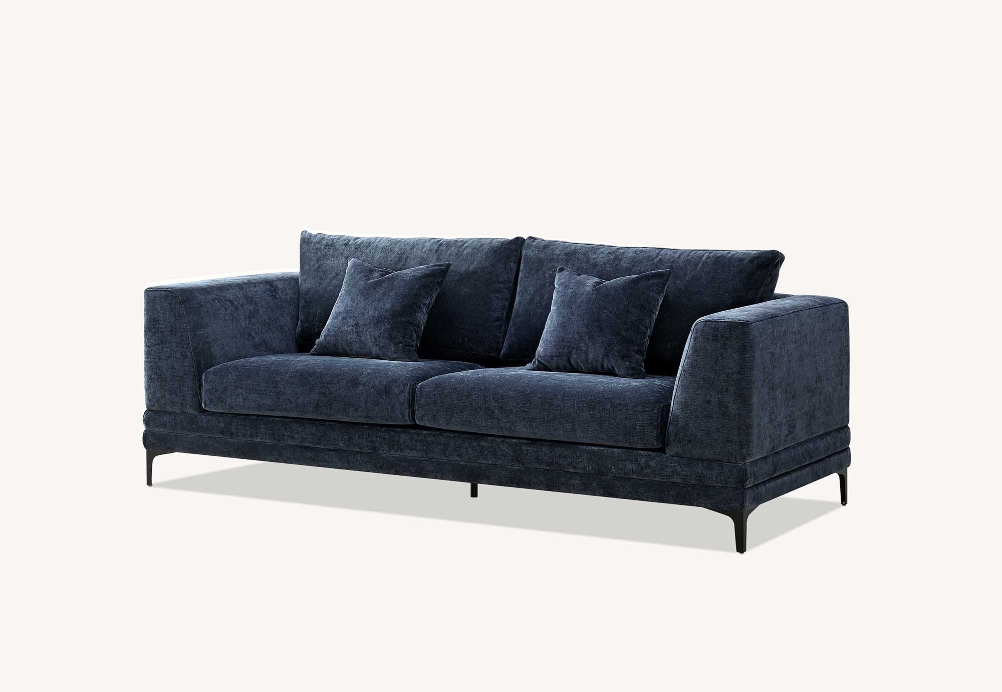 Lenox three seater sofa in aegean blue velvet at a three quarter angle