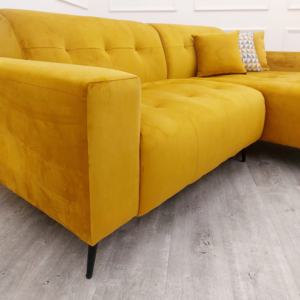 Detail of the Oslo leg and scatter cushions in mustard
