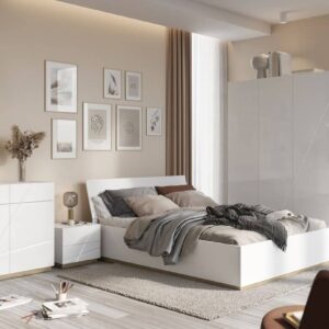 Futura FU-14 Bedside Cabinet in White Gloss - in a bedroom setting beside a white bed, with the matching Futura range