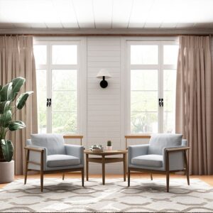 Two Alfie chairs in grey linen-mix with washed oak ash frames either side of a round side table in a bright living room