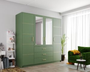 Bali II 4 door wardrobe in Bottle Green with gold trim in a room with a green armchair