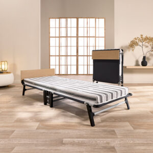 Jay-Be Quick QE80 folding bed open with striped Comfort Stripe mattress and wooden headboard in a bright room