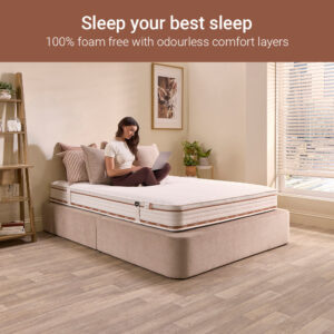 Woman sitting on the Jay-Be Ryze 800 mattress, 100% foam-free comfort layers