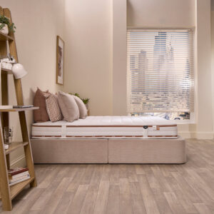 Side view of the Jay-Be Ryze Deep Quilted mattress on a divan base showing its depth and quilted panels