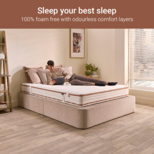 Man resting on a Jay-Be Ryze Memory foam-free sprung mattress in a modern bedroom