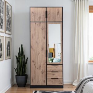 Lati 2 door wardrobe in Oak Viking and black with mirrored door, three drawers and top unit in a bright bedroom
