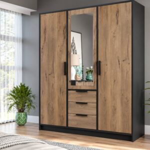 Lati 3 door wardrobe in Oak Viking and black with a mirrored centre door and three drawers in a bedroom