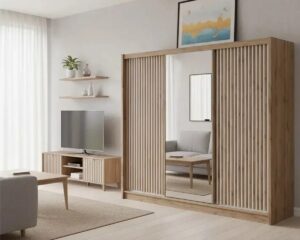 London 250cm 3 door mirrored sliding wardrobe in Oak Wotan / White Matt in a living room