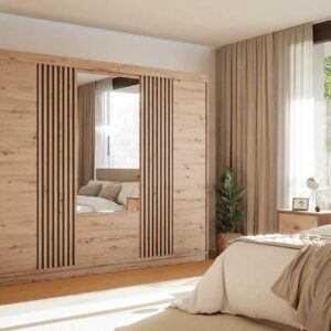 Mallorca 250cm wardrobe in Oak Artisan with mirrored centre doors and black slatted sliding panels in a bedroom