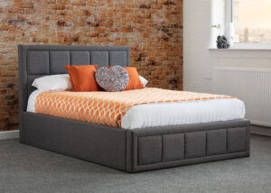 Sia upholstered ottoman bed styled in a bedroom