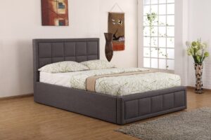 Sia grey fabric ottoman bed in a bright bedroom