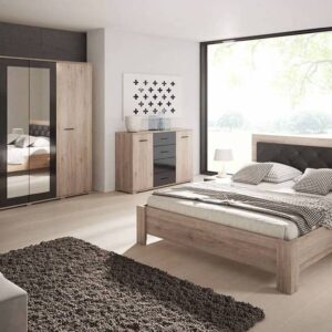 Bari Bedside Cabinet in Oak San Remo and Black - in a bedroom setting with the matching Bari wardrobe, chest and bed