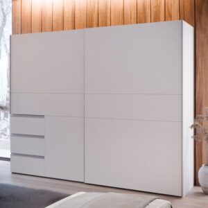 Winn II 250cm sliding wardrobe in White with three front drawers in a wood-panelled bedroom
