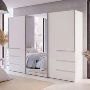 Winn II 270cm white 3 door sliding wardrobe with mirrored centre door in a bedroom